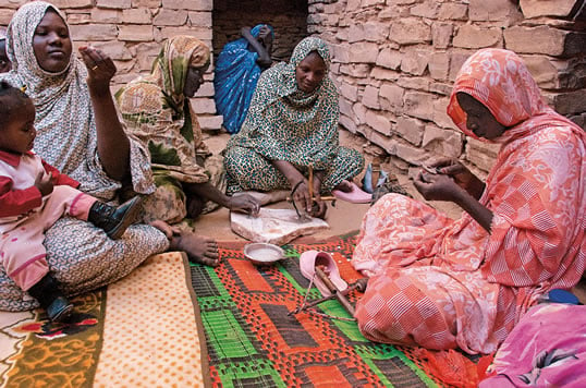 Smoothing each fragment of shell on a granite slab and carefully hand-drilling it with up to five holes, the women of Tichit have made beads a specialty. They trade their beads throughout Mauritania and into Mali. 