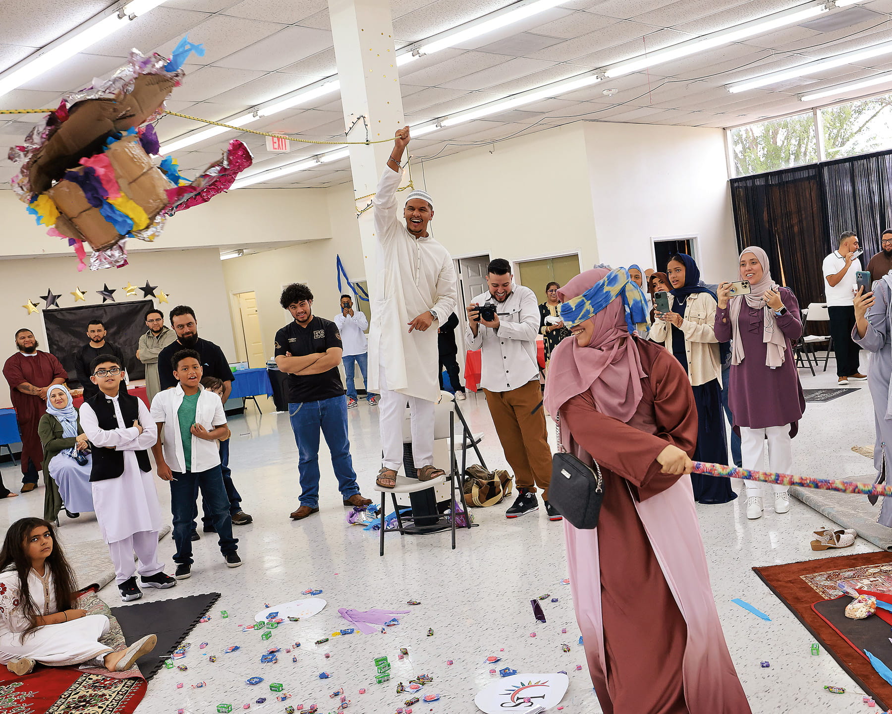 For Latino Muslims Eid celebrations include taking turns hitting a piñata while blindfolded until its candy spills out for children.