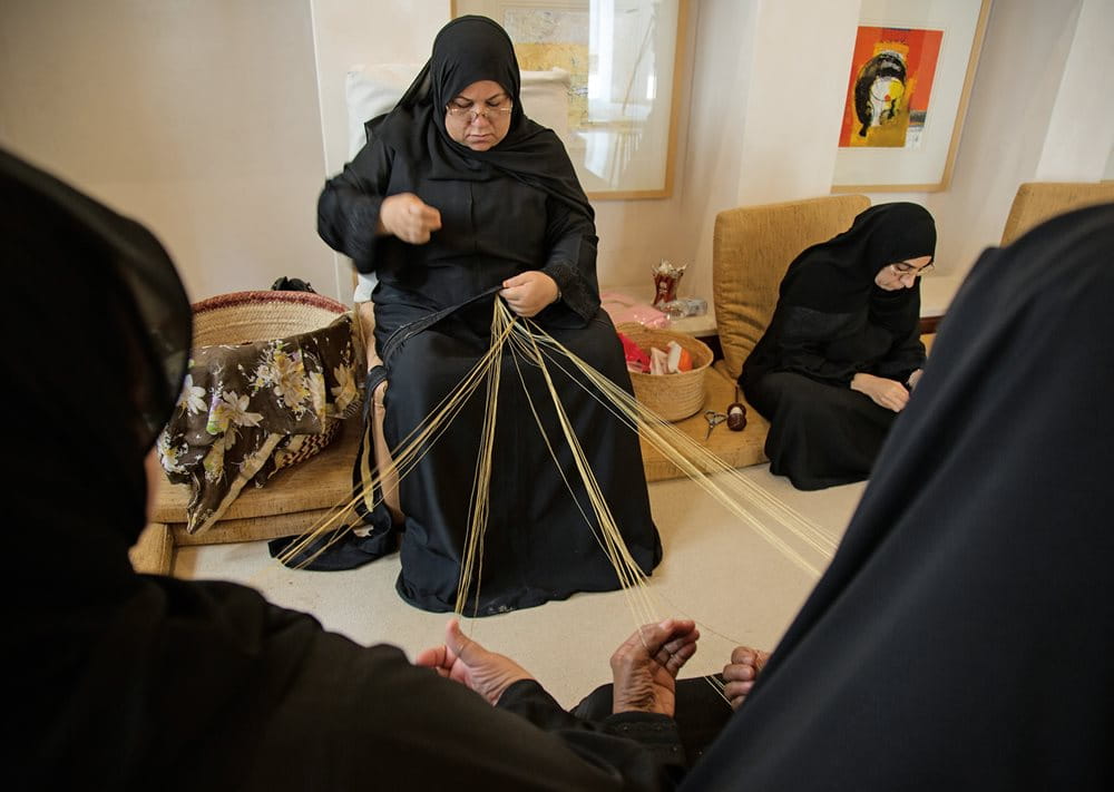 At Kurar House, embroiderers deftly entwine gold threads to make one of Muharraq's most famous crafts, the decorative fabric trim after which the house is named. 